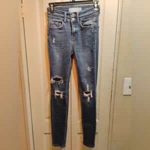 High-Rise Distressed Skinny Jeans in Medium Blue